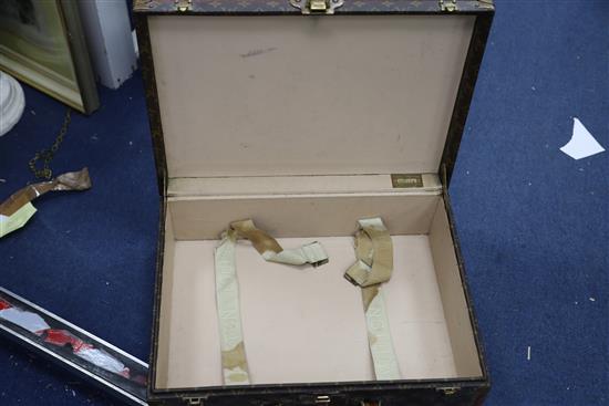 A Louis Vuitton suitcase, 20 x 14.5 x 7in.